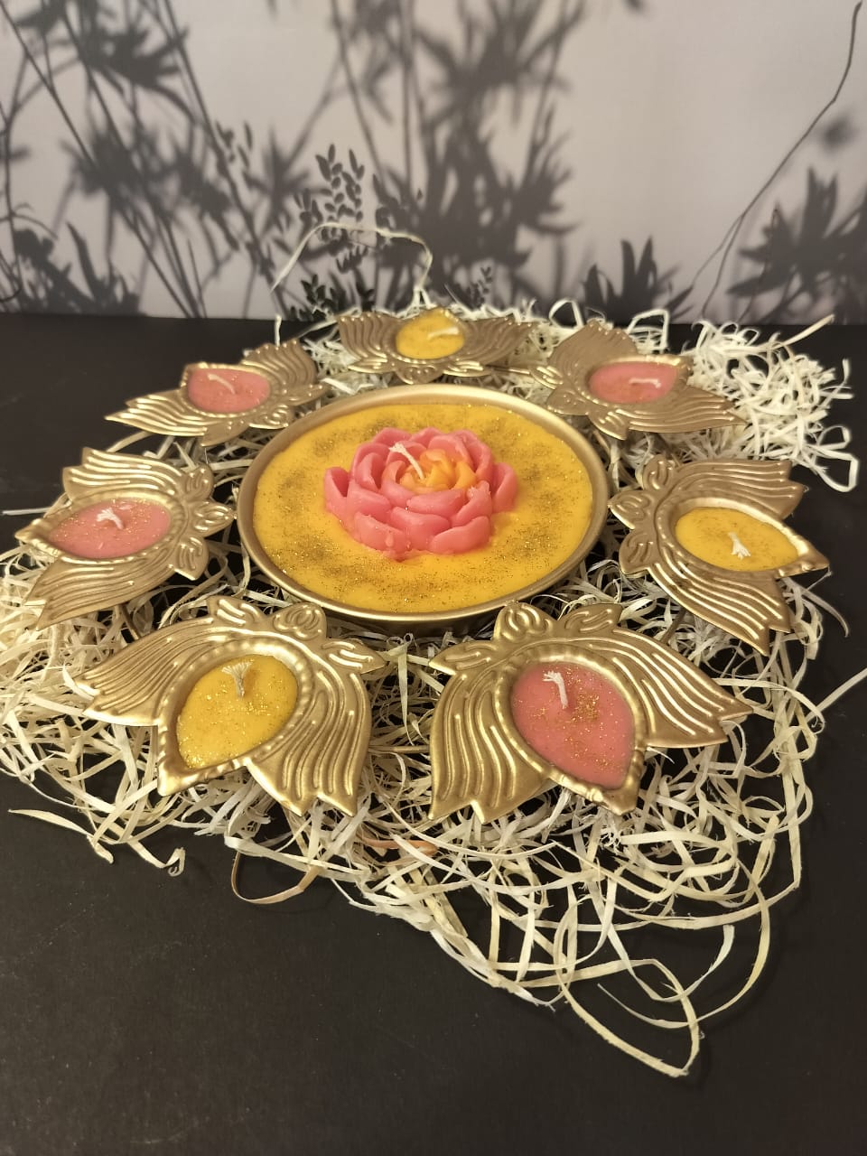 Pink and yellow lotus-shaped candle