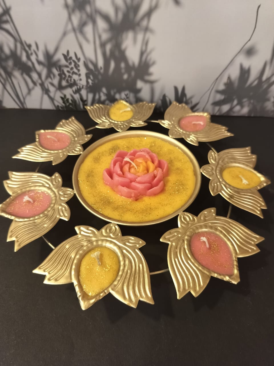 Pink and yellow lotus-shaped candle